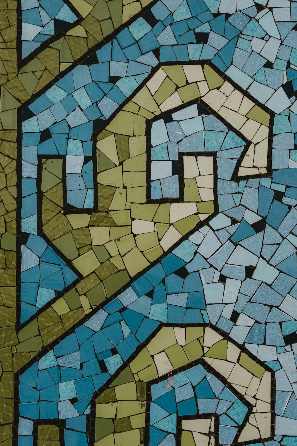 a close up of a mosaic tile design