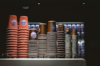 Stacks of colorful disposable cups ready for delivery to local cafes.
