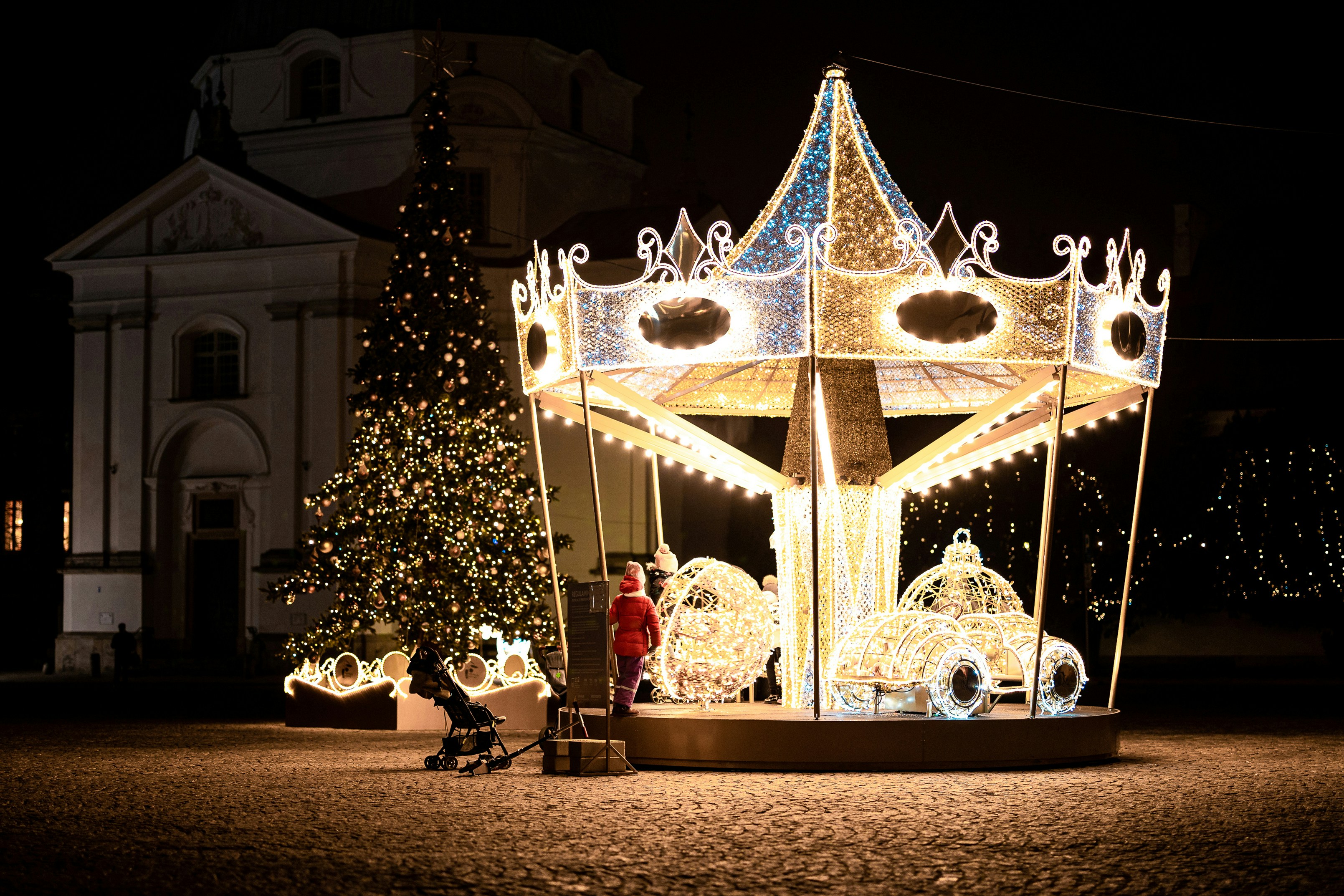 gold and white christmas tree with string lights