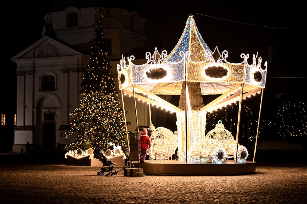 gold and white christmas tree with string lights