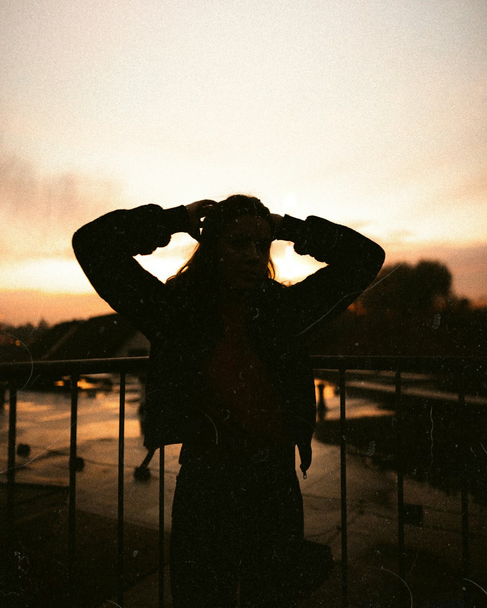 silhouette of person holding camera