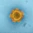a yellow substance with red dots in it