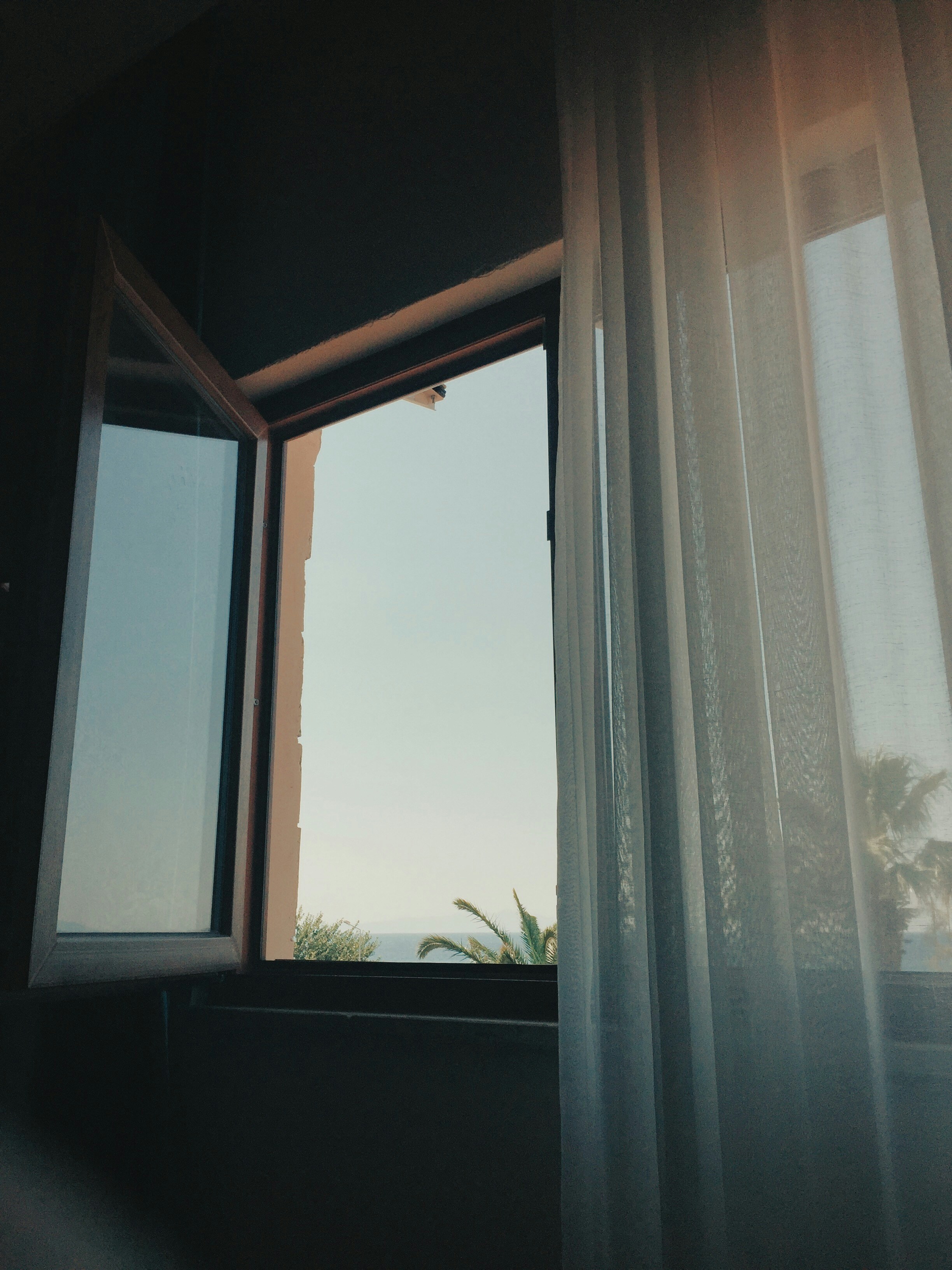 white window curtain on window