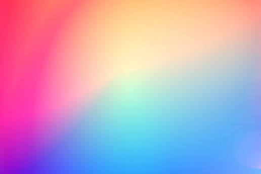 A smooth gradient blending vibrant colors including pink, purple, orange, yellow, and blue, creating a soft and calming visual effect.