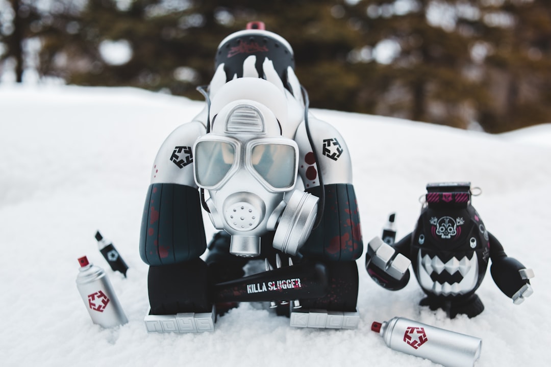 black and red robot toy on snow