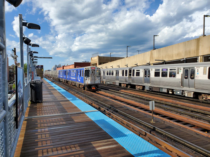 Red and Purple Line CTA trains at a Chicago elevated platform