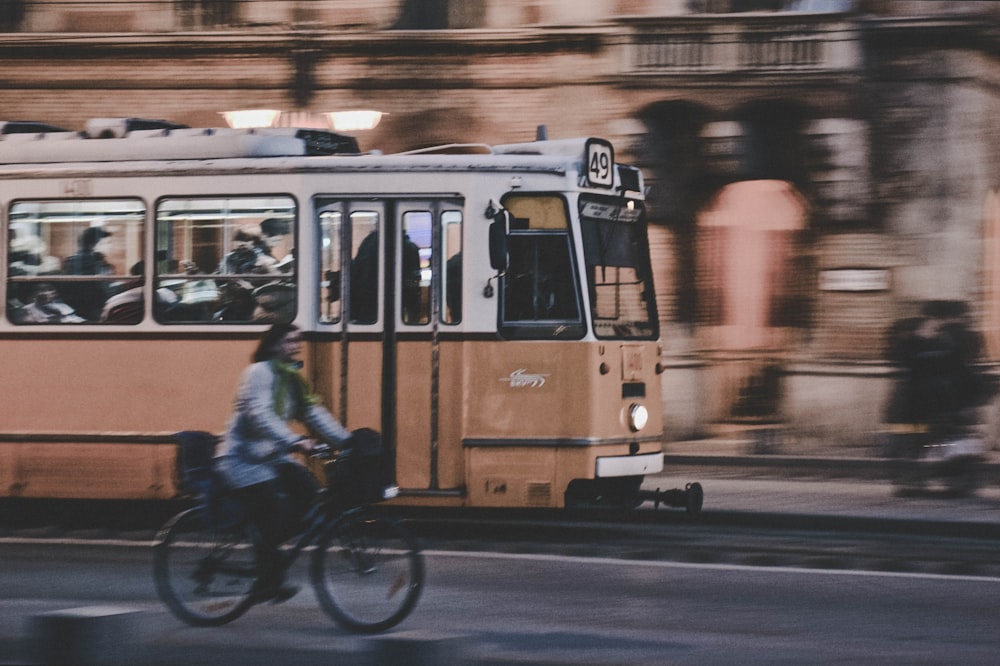 people riding on yellow tram during night time