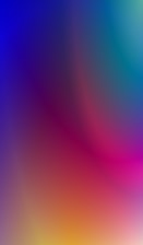 A vibrant gradient blending a spectrum of colors, including deep blues, purples, pinks, and oranges, creating a smooth transition across the image.