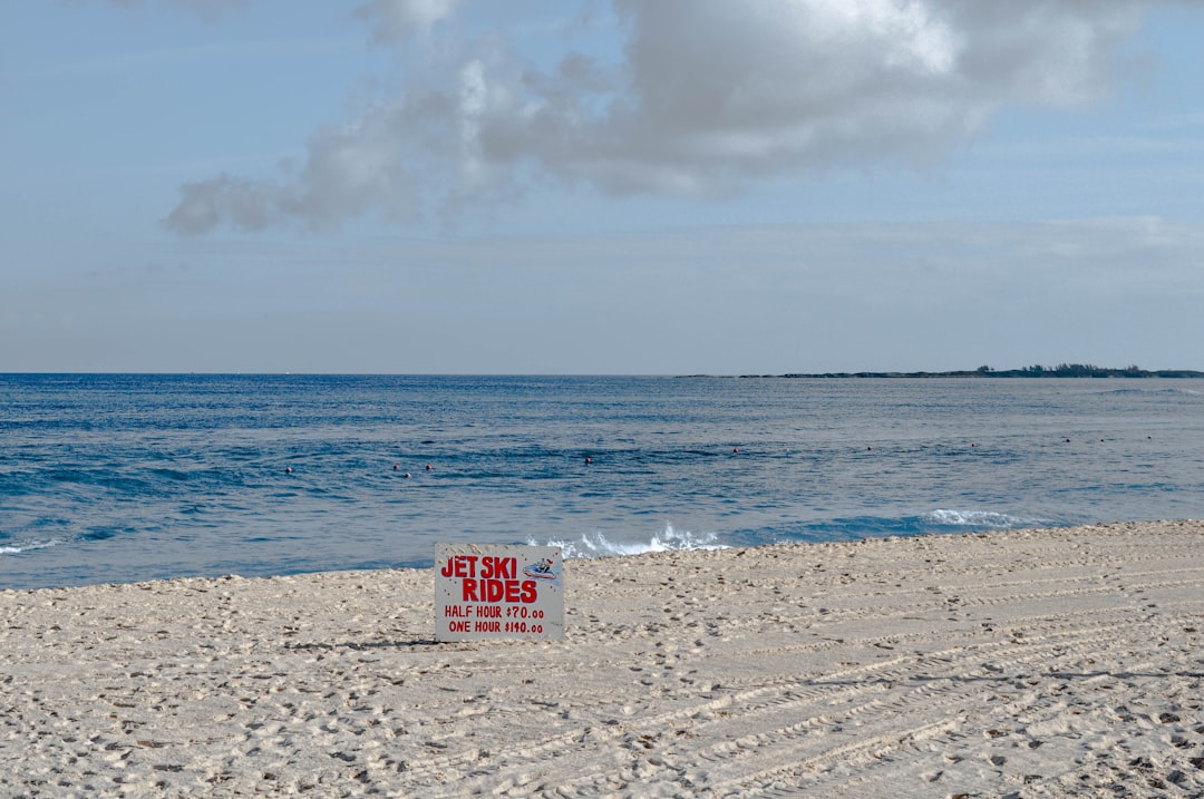 red and white polka dot box on beach during daytime