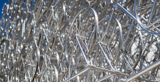 silver wire fence in close up photography