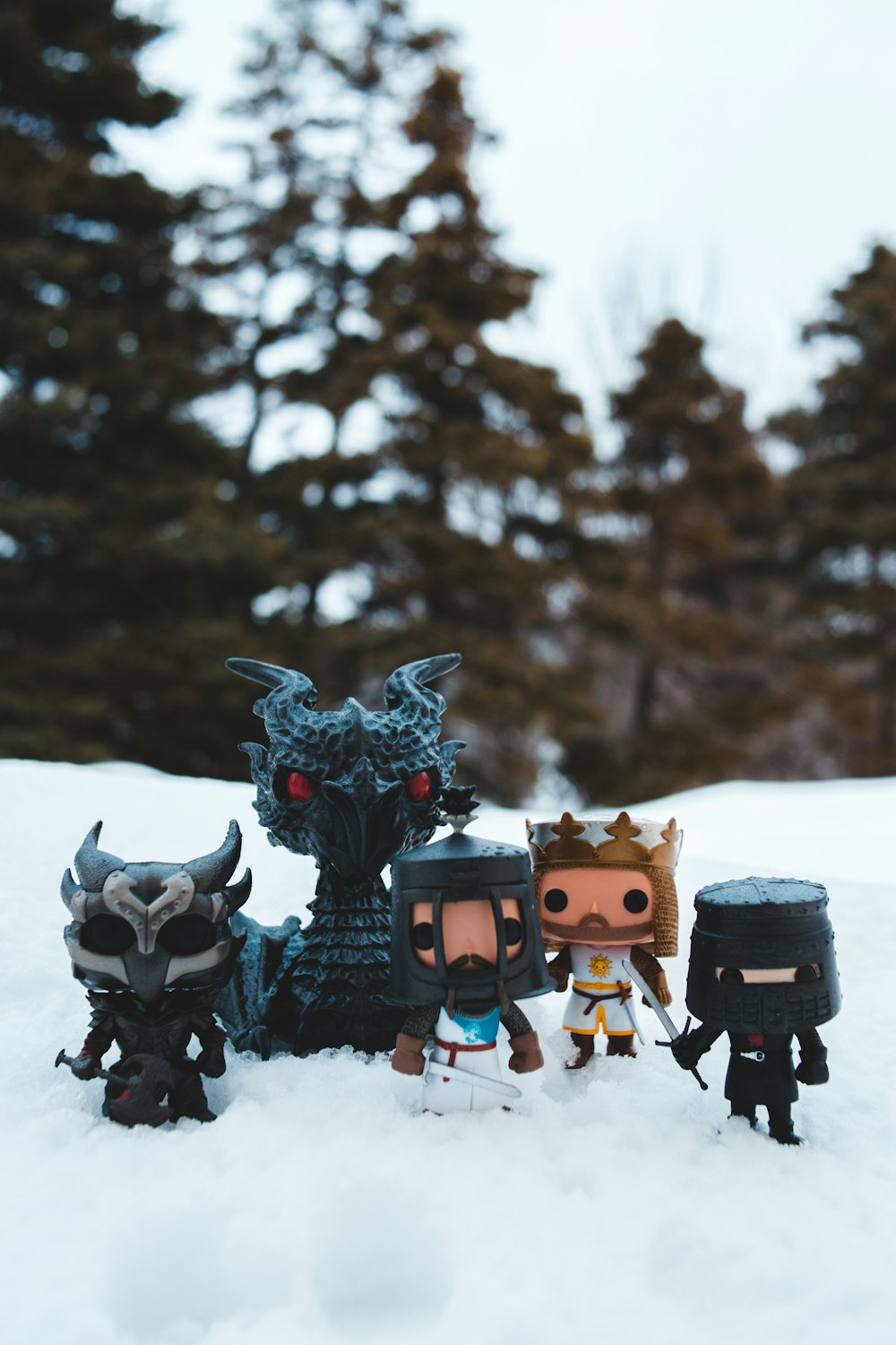 brown and black robot toys on snow covered ground