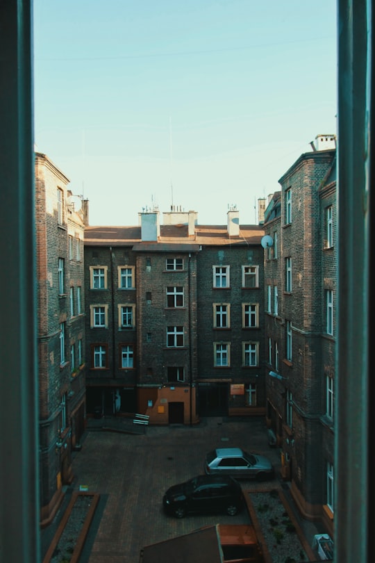 brown concrete building during daytime in Katowice Poland