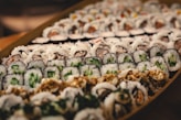 green and white vegetable on brown wooden tray