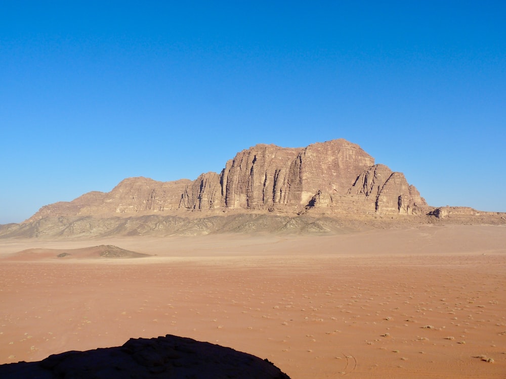 brown rocky mountain under blue sky during daytime