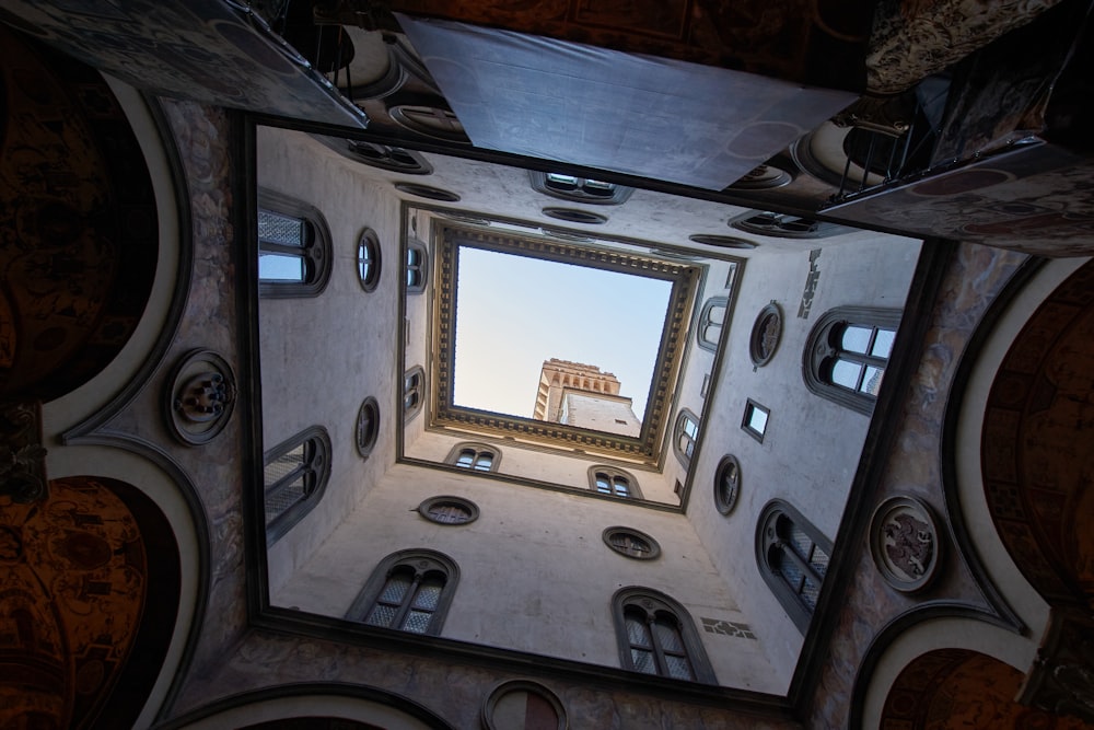 black and white ceiling with brown wooden frame