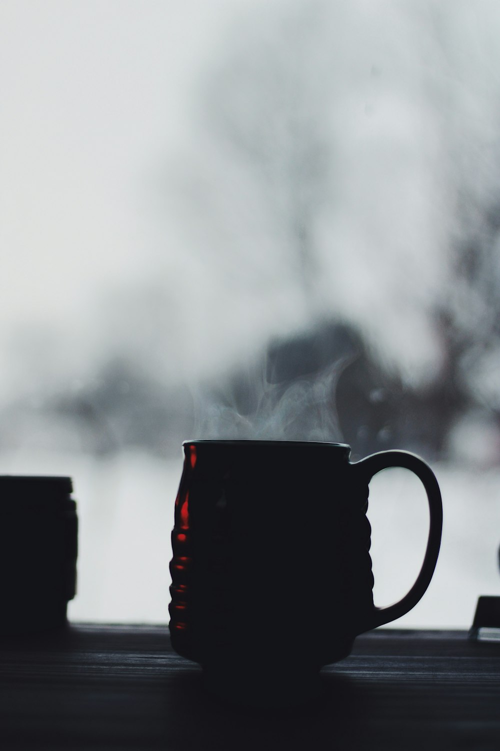 black ceramic mug with white smoke