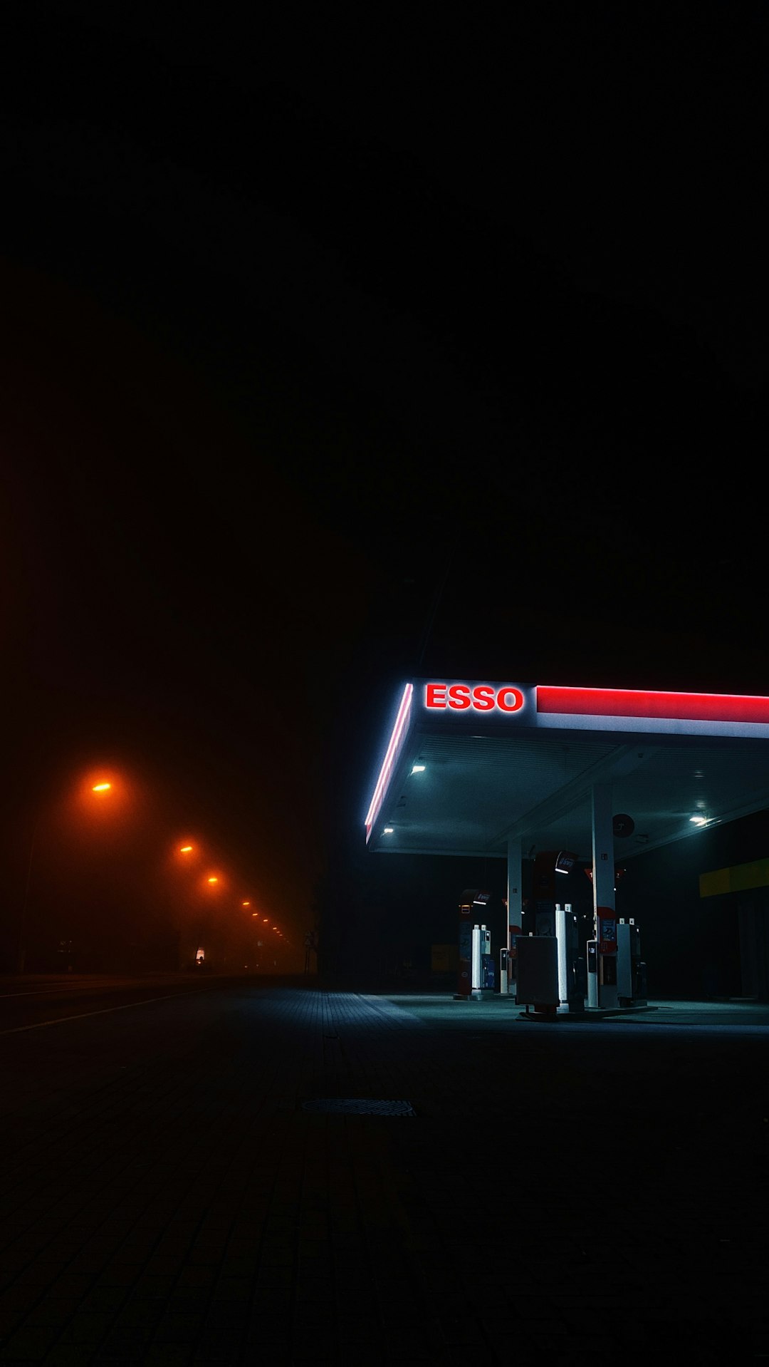 red and white store signage during night time