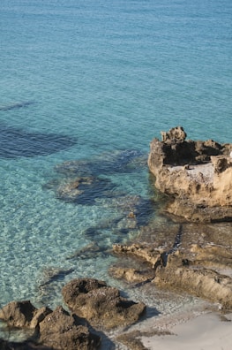 Turquoise waters and sandy beaches along Antalya’s coastline under a bright sun.