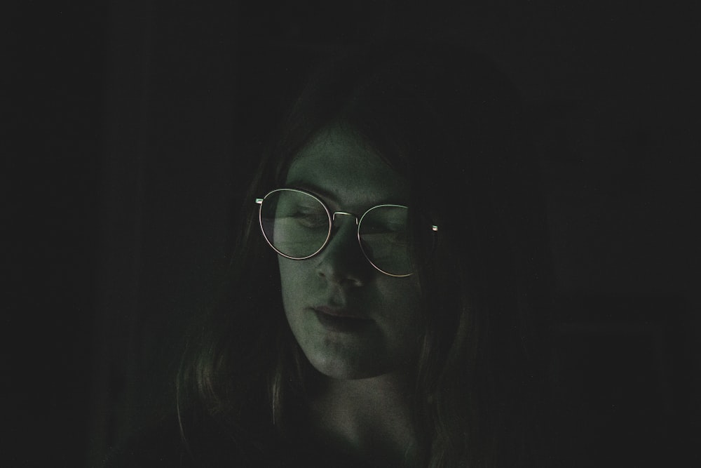 woman wearing black framed eyeglasses