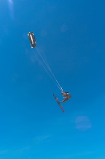 Advanced student landing a jump with perfect form during a Sicily kitesurf camp