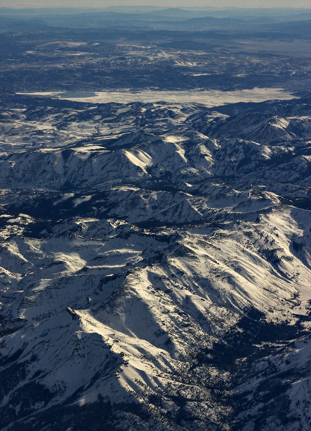 aerial view of snow covered mountains during daytime