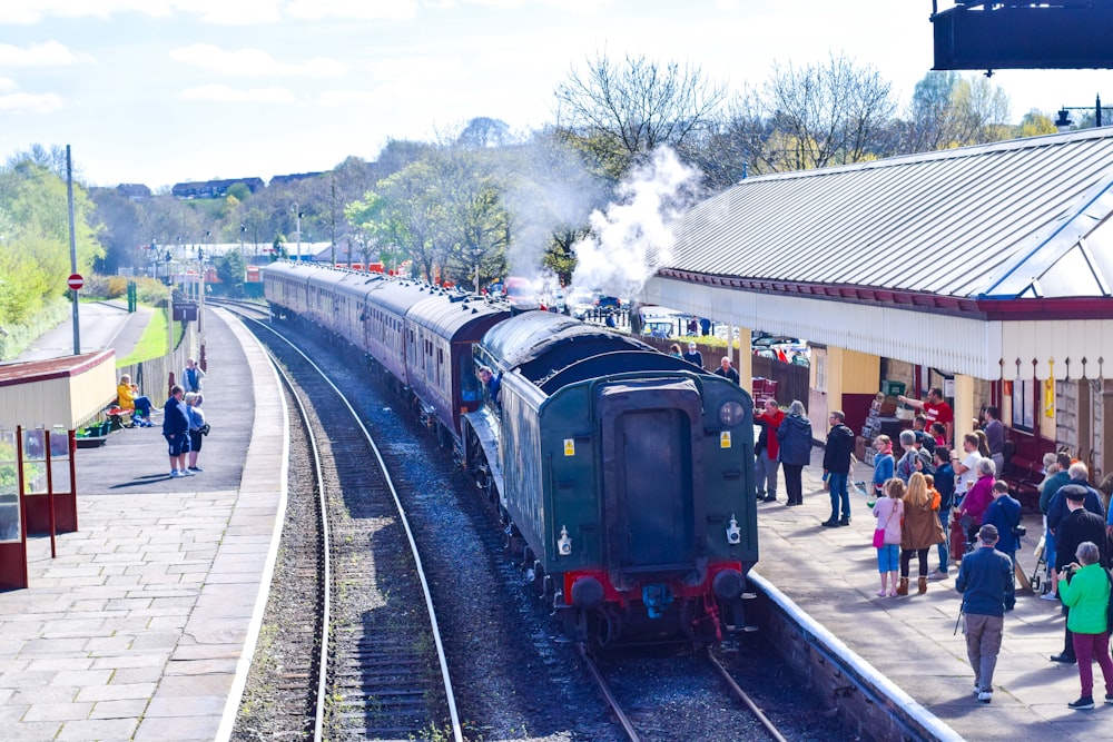 people walking on train station during daytime