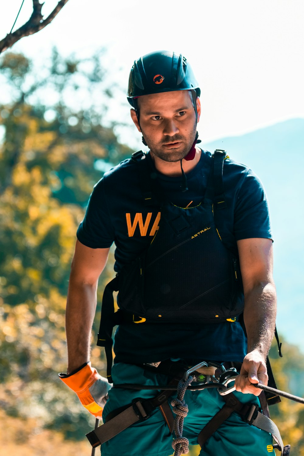 man in black crew neck t-shirt and blue cap