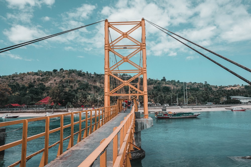 brown bridge over river during daytime