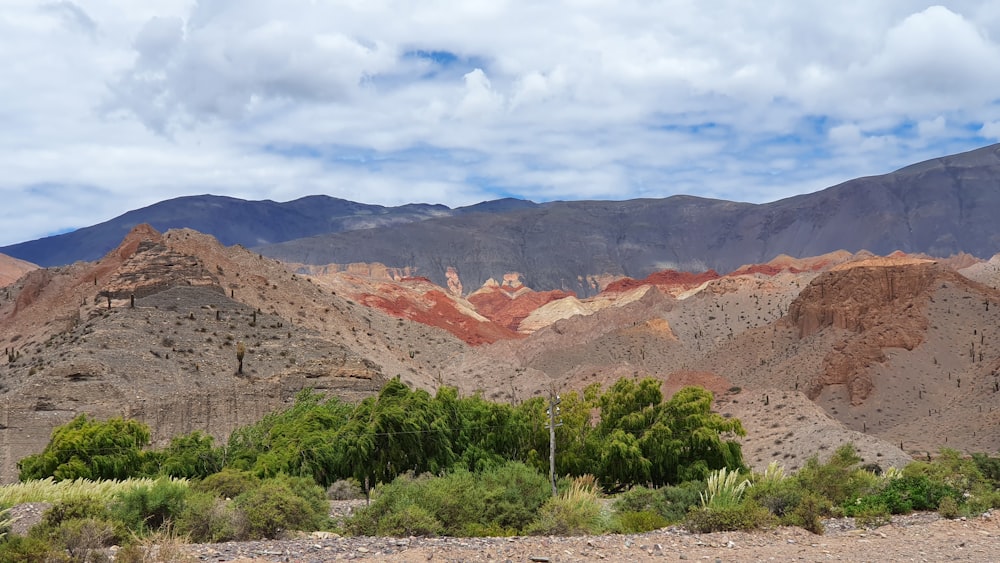 brown mountain under white clouds during daytime