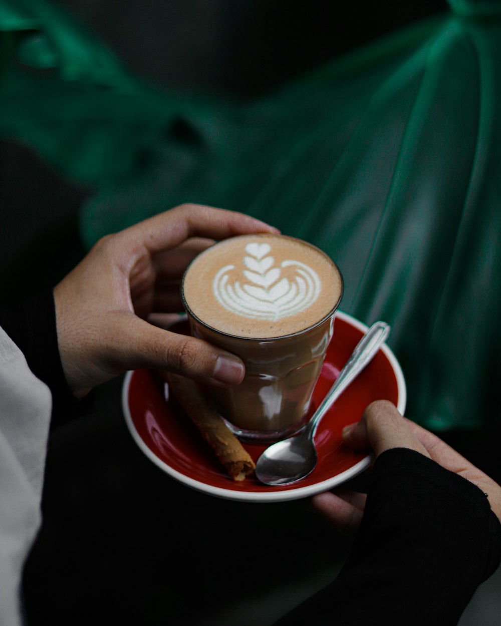 person holding white ceramic mug with coffee