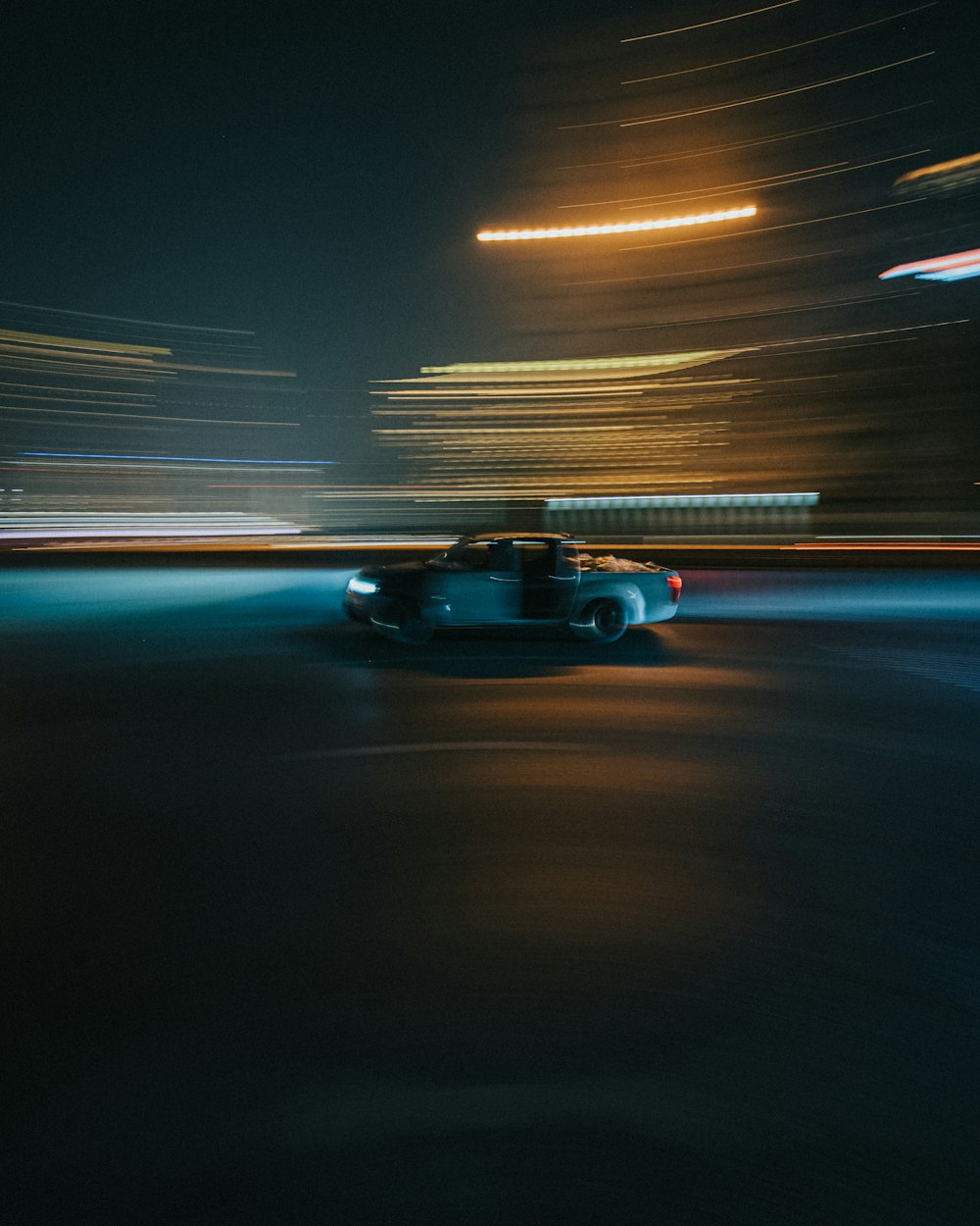 black car on road during night time