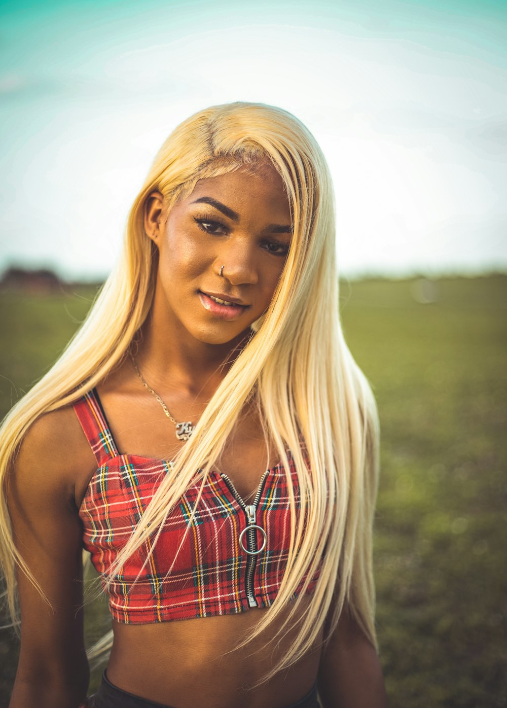 woman in black and white plaid sleeveless shirt