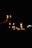 A peaceful meditation scene with candles and soft lighting.