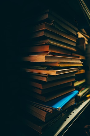 stack of books on black background