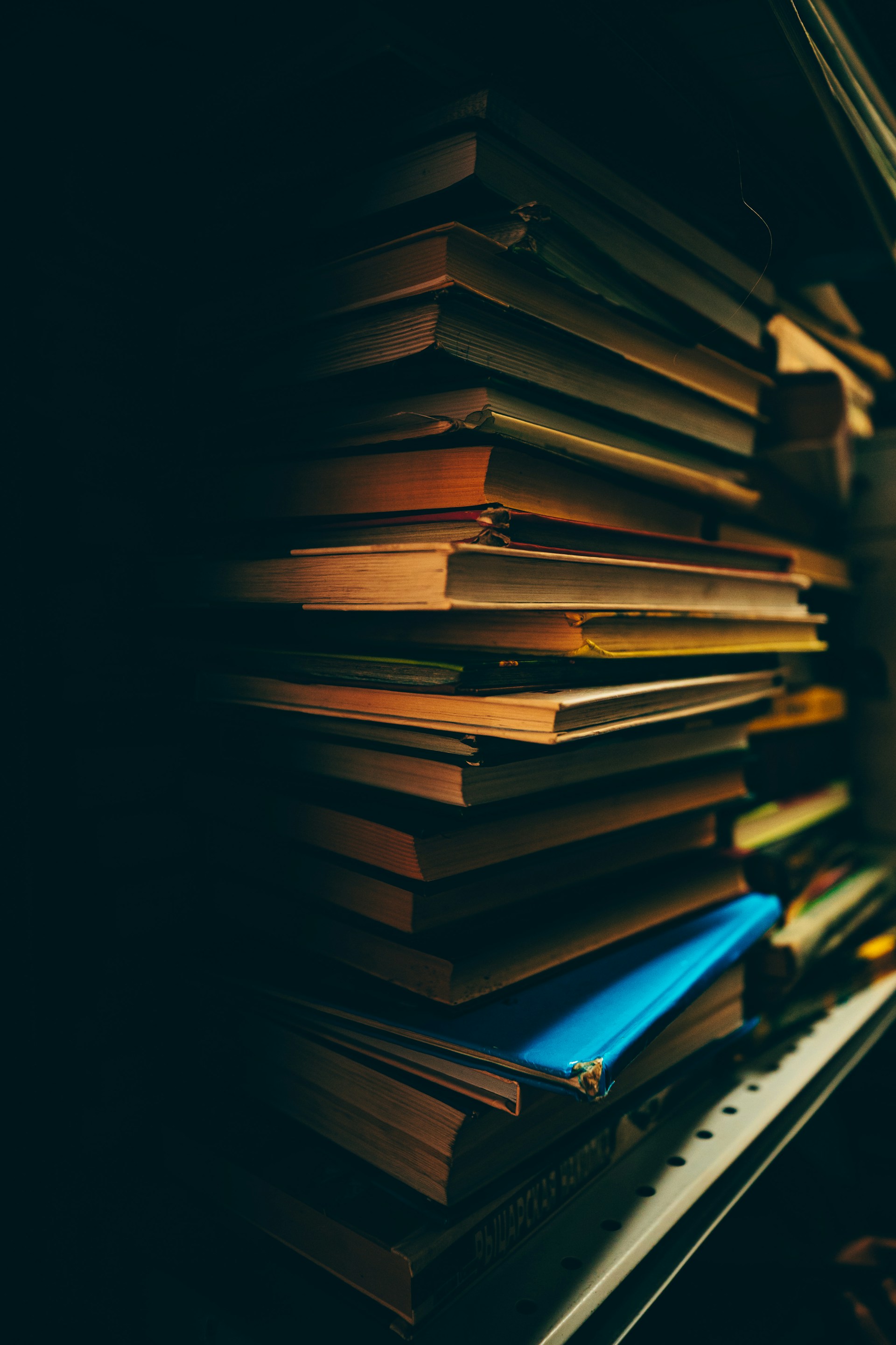 stack of books on black background