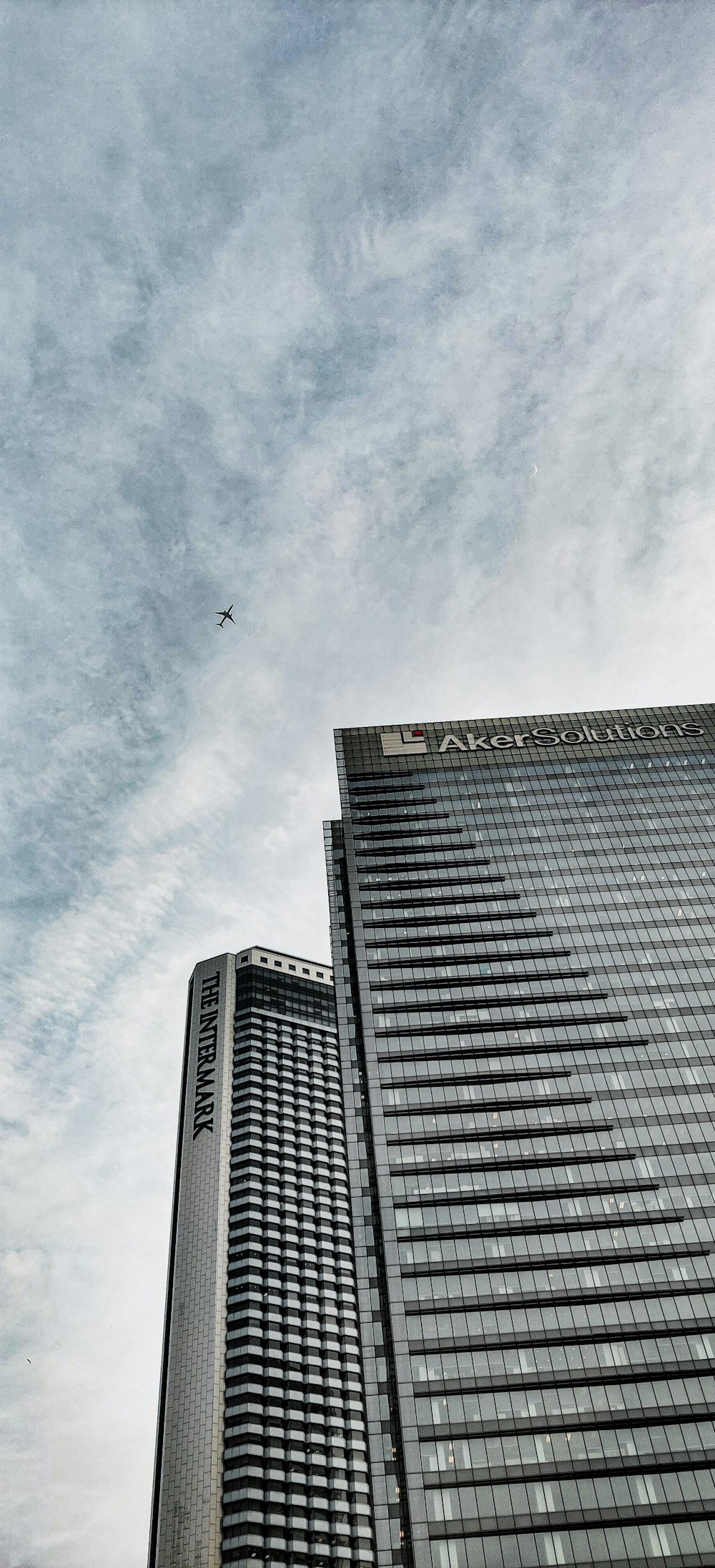 low angle photography of high rise building under blue sky during daytime