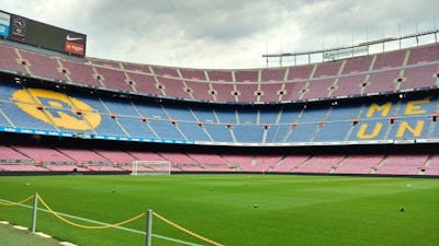 A football stadium backdrop with a subtle overlay of legal scales symbolizing justice.