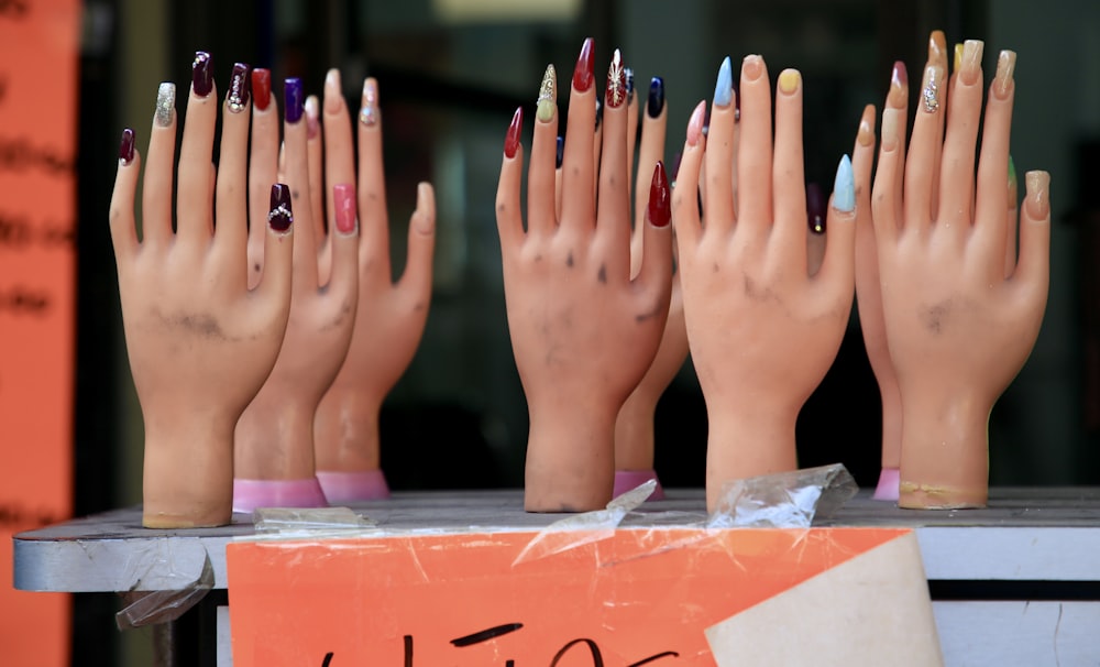 person with pink manicure on left hand