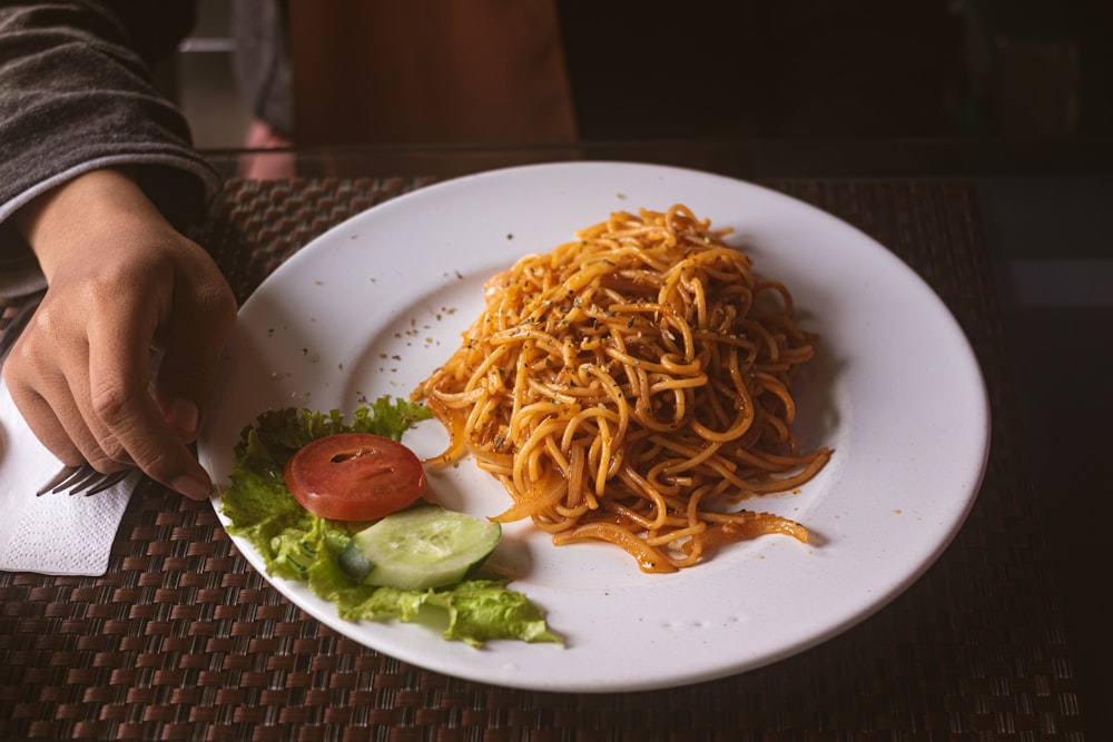 spaghetti on white ceramic plate