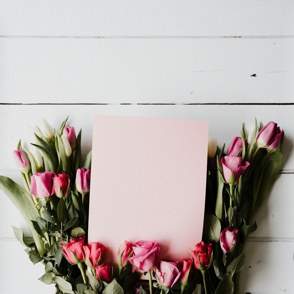 pink and white flowers on white table