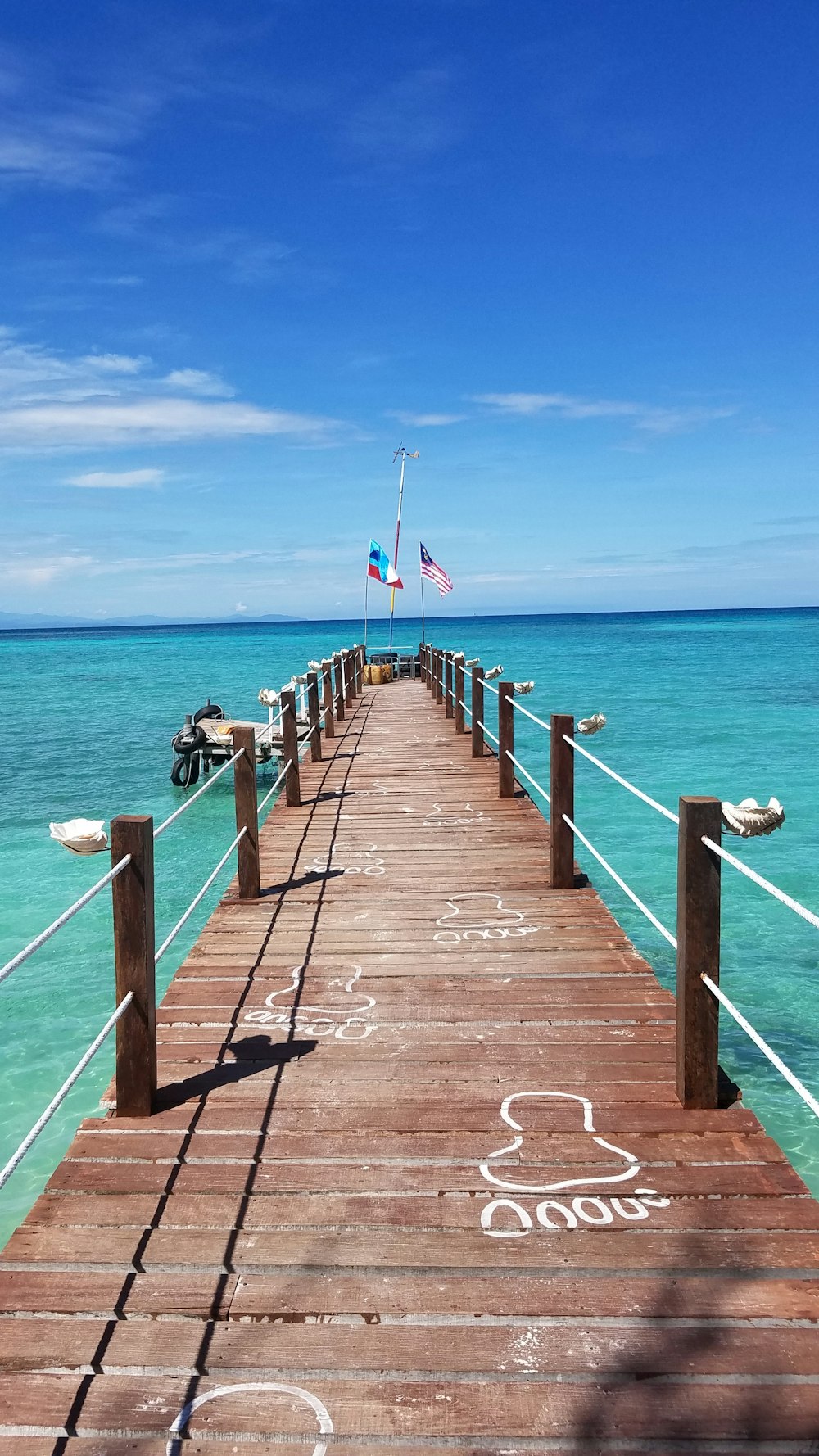 people walking on wooden dock during daytime