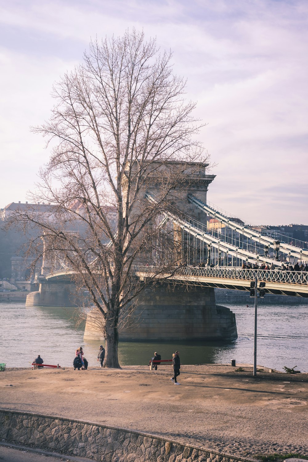 people walking on bridge during daytime