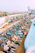 A happy family enjoying a sunny day on the deck of a Caribbean cruise ship, with kids playing nearby.