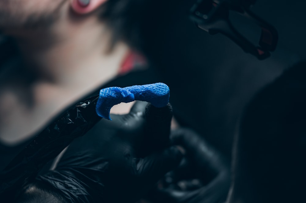 woman in blue nail polish
