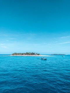 people riding on boat on sea during daytime