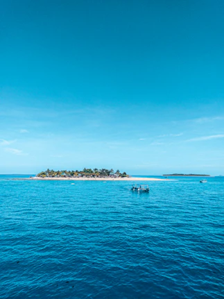 people riding on boat on sea during daytime