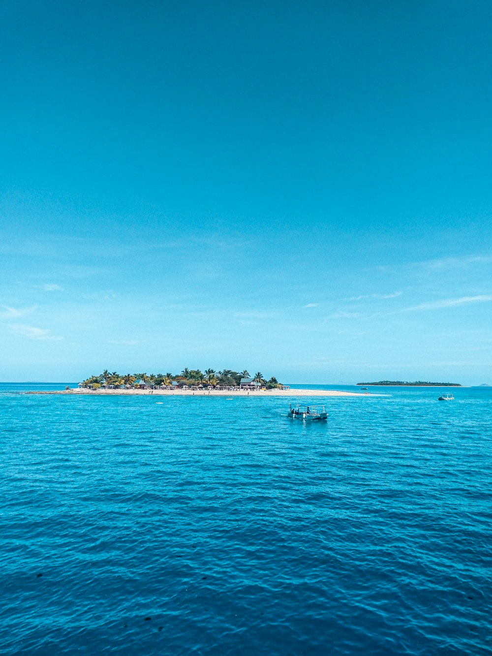 people riding on boat on sea during daytime