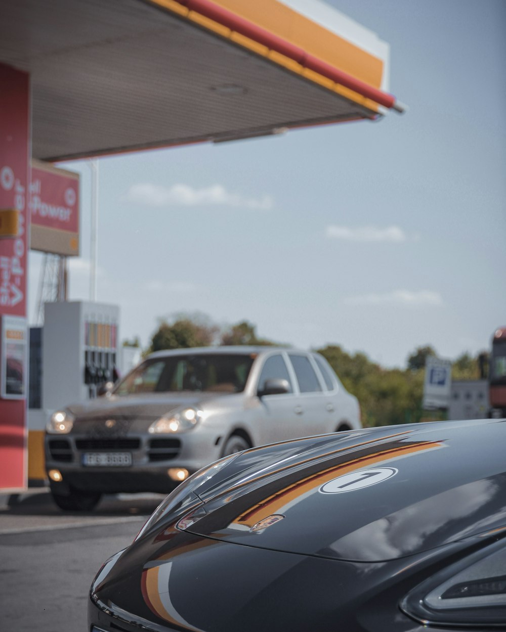 black car parked near red and white building during daytime