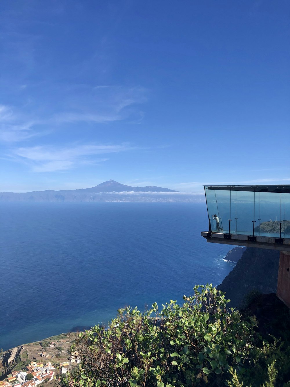 blue body of water under blue sky during daytime