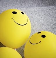 yellow smiley emoji on gray textile